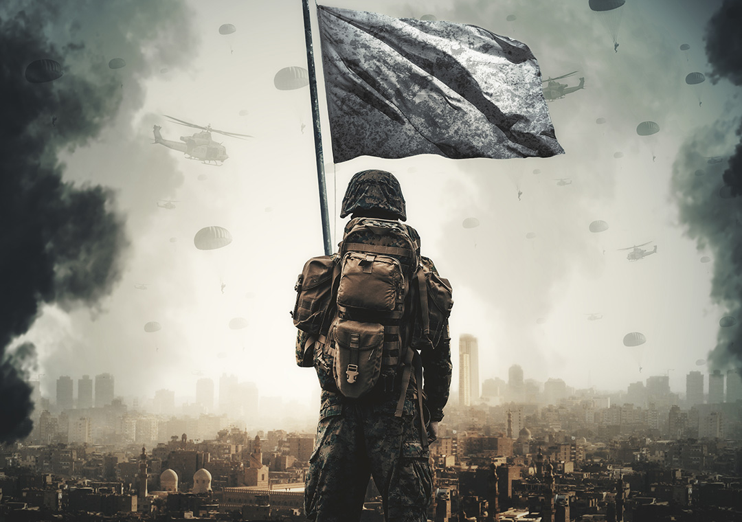 A soldier carries a white flag as he surveys a ruined city devastated by war
